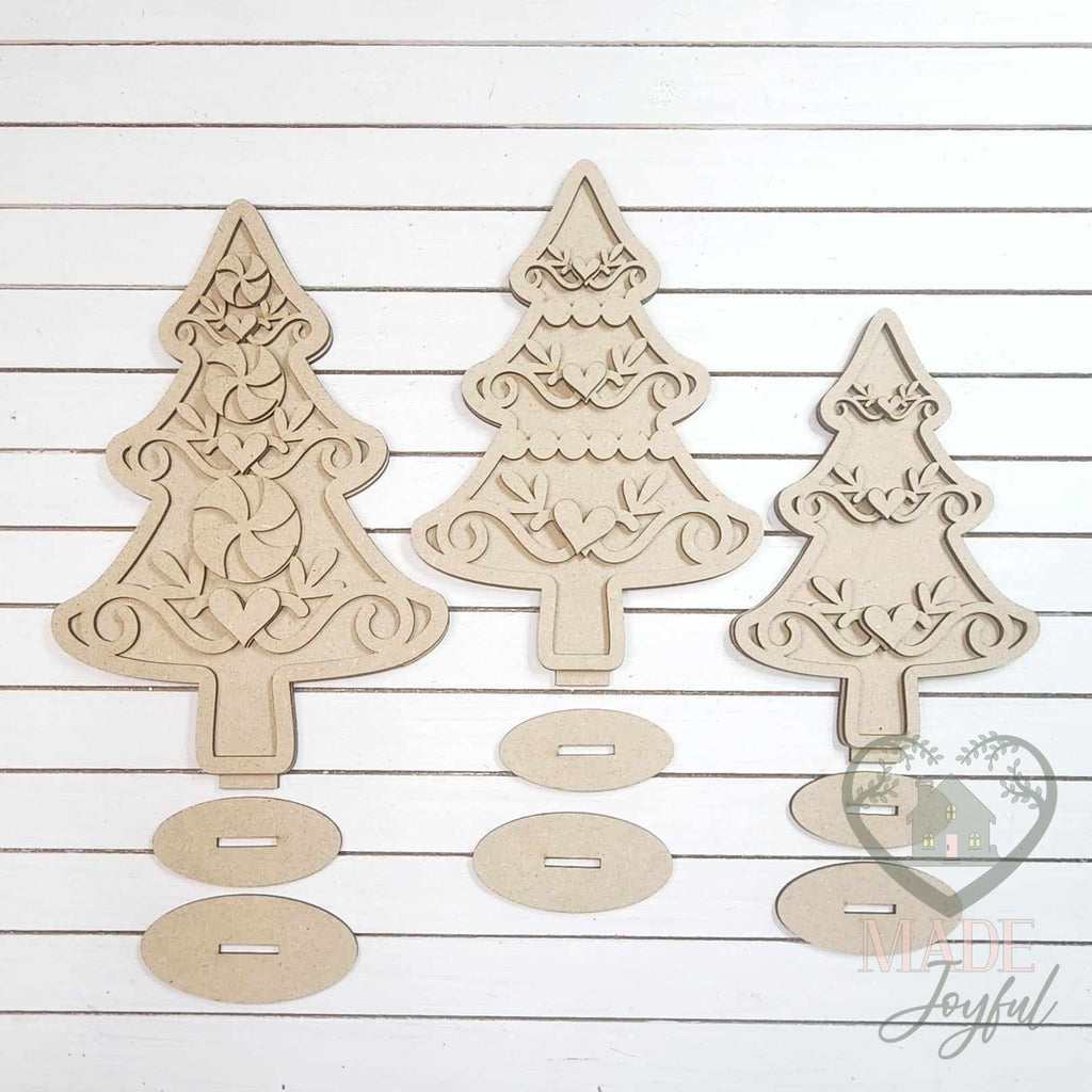 Unfinished laser-cut wood Gingerbread Christmas Tree Shelf Sitters DIY kit, ready to paint at a DIY party in Williamson County, TN.
