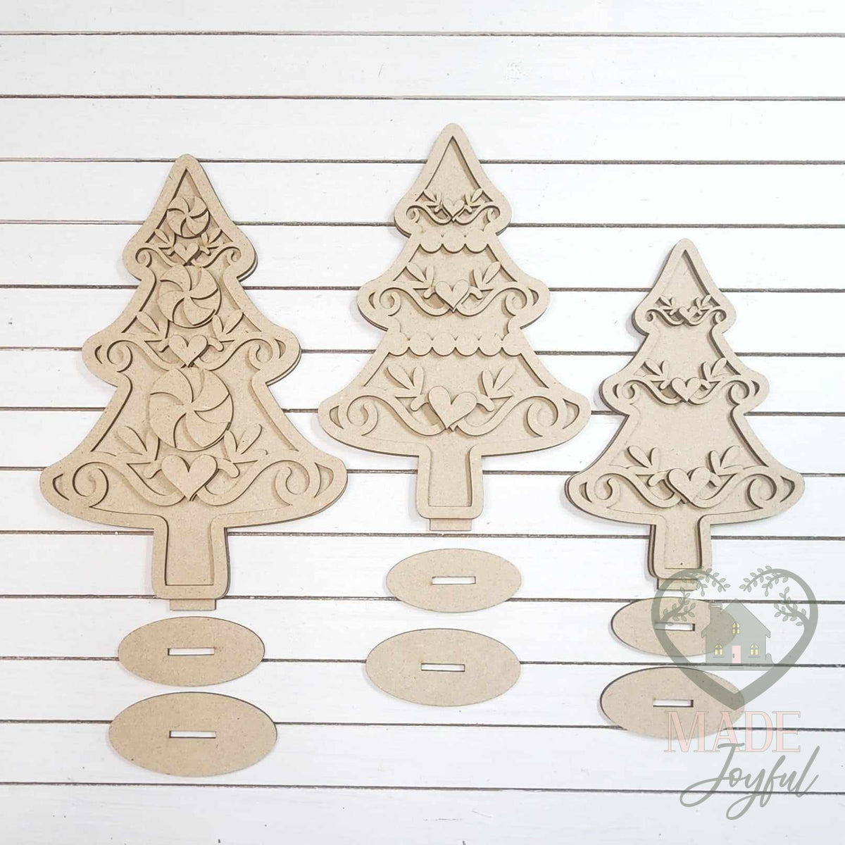 Unfinished laser-cut wood Gingerbread Christmas Tree Shelf Sitters DIY kit, ready to paint at a DIY party in Williamson County, TN.