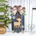 Oh Deer wooden Christmas sled painted navy with a reindeer, snowflakes, and a red striped bow, hand-painted in Brentwood, TN.