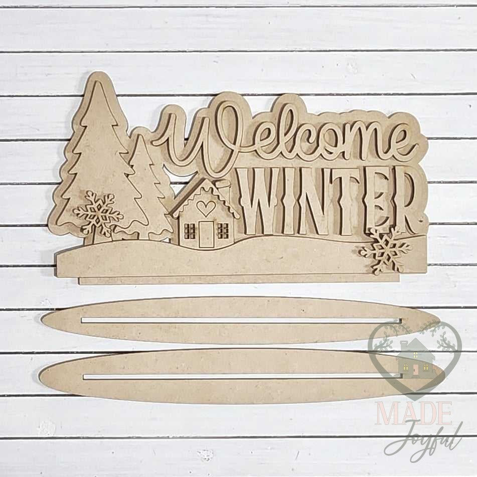 Unfinished laser-cut wood Welcome Winter Cabin Word Art DIY kit, ready to paint at a DIY party in Williamson County, TN.