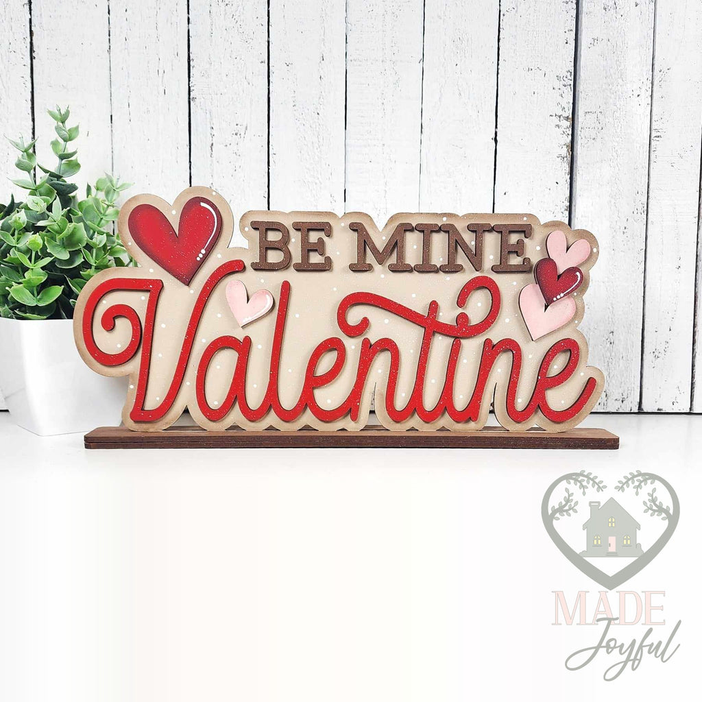 Be Mine Valentine word art shelf sitter in red and pink with hearts, hand-painted in Brentwood, TN.