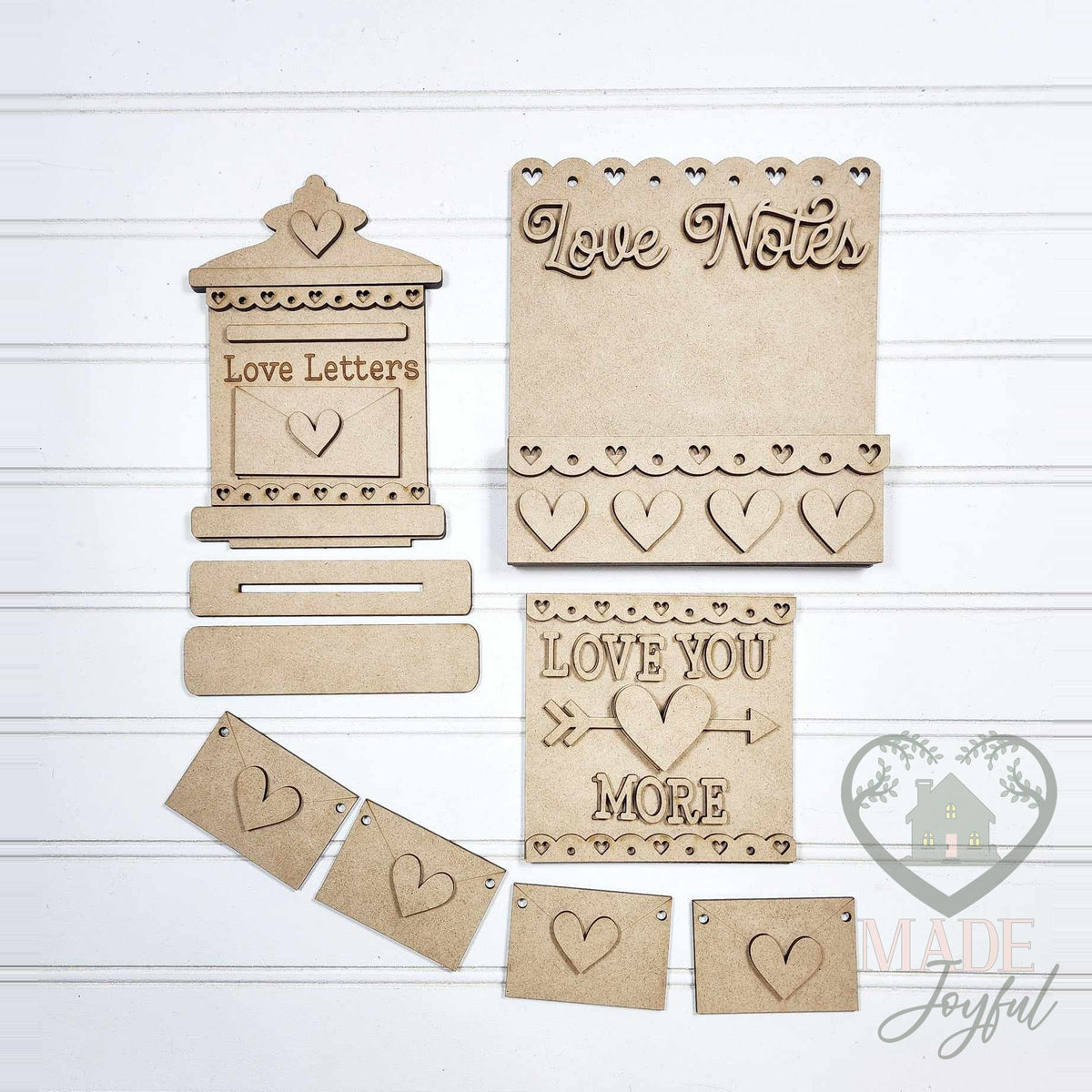 Unfinished laser-cut wood Valentine Love Notes Tiered Tray Decor Set DIY kit, ready to paint at a DIY party in Williamson County, TN.