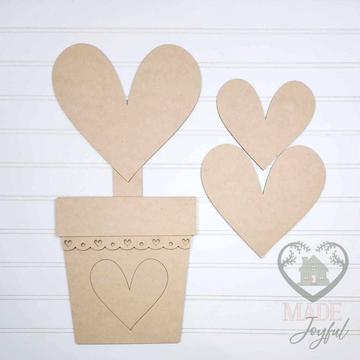 Unfinished laser-cut wood Be My Valentine Porch Leaner DIY kit (heart topiary pieces), ready to paint at a DIY party in Williamson County, TN.