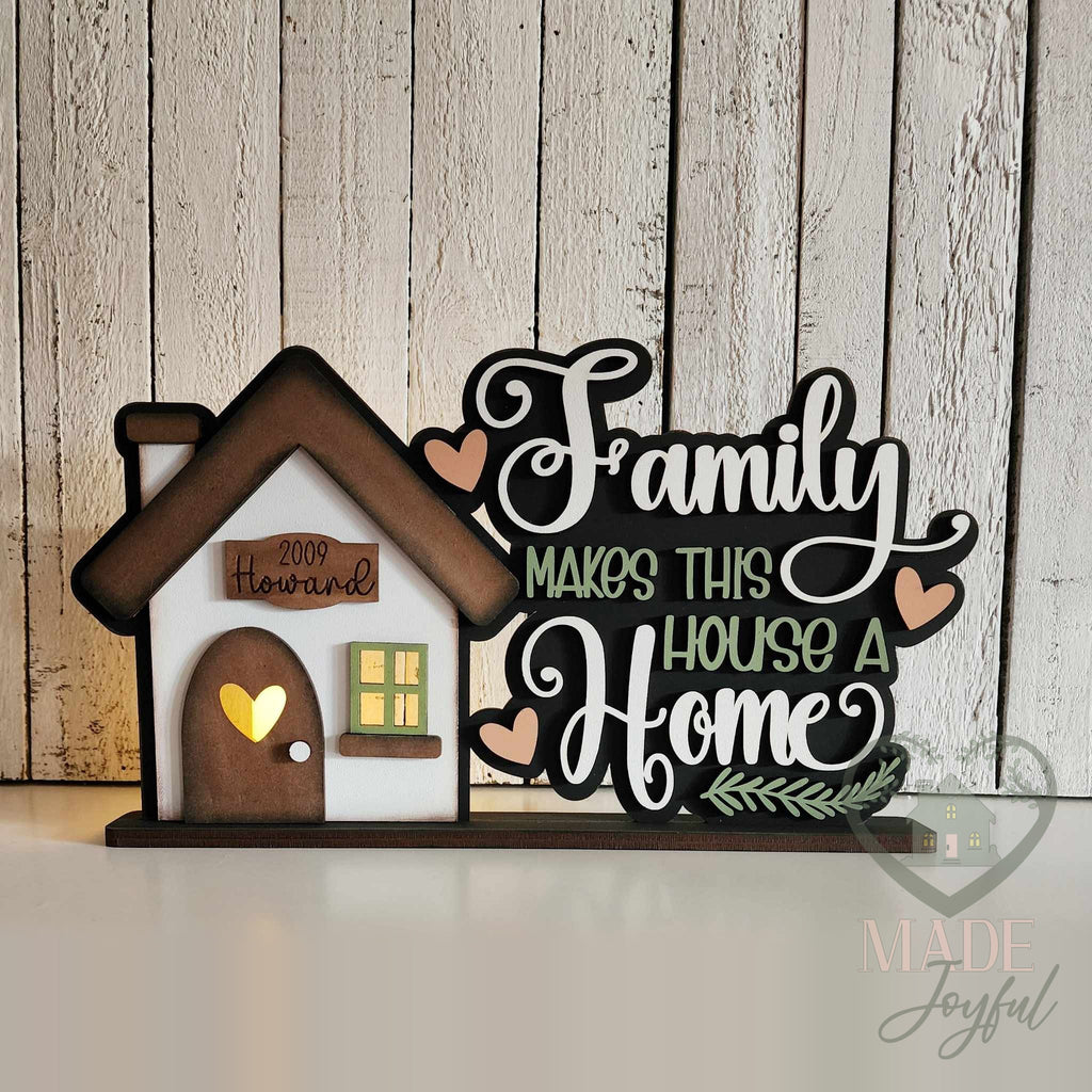 Family Makes This House a Home word art glowing from a tealight, hand-painted in Brentwood, TN.