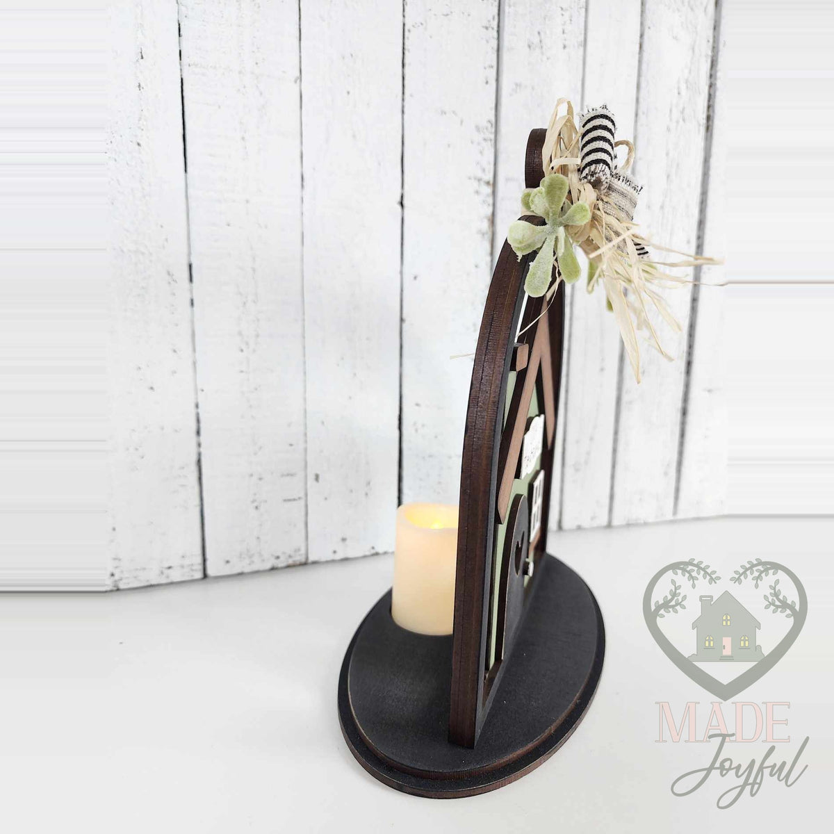 Side view of the home cloche with a glowing LED tealight, hand-painted in Brentwood, TN.