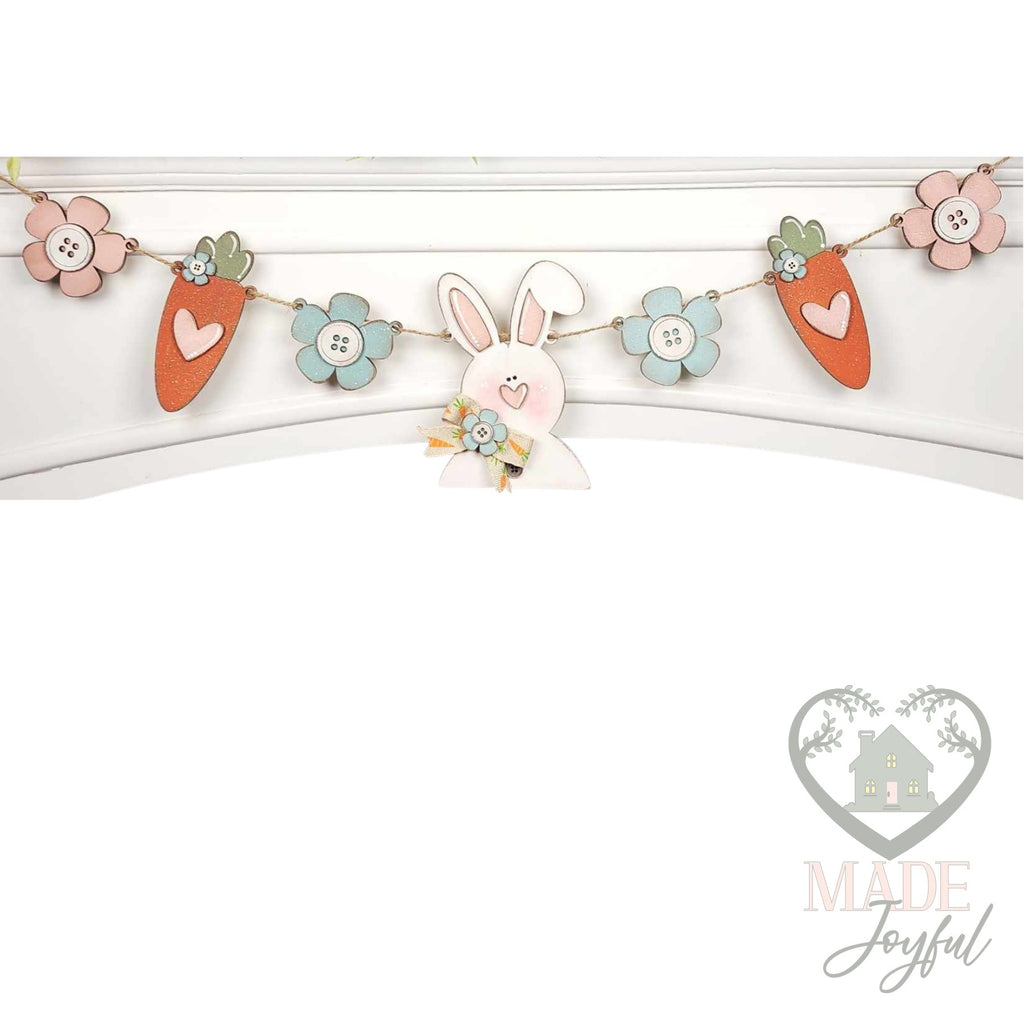 Prim bunny and carrot Easter banner with button flowers on a mantel, hand-painted in Brentwood, TN.