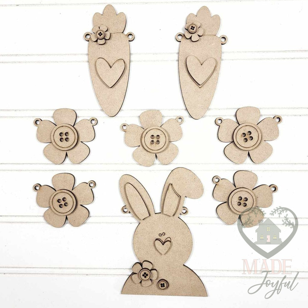 Unfinished laser-cut wood Prim Bunny & Carrot Easter Banner DIY kit, ready to paint at a DIY party in Williamson County, TN.