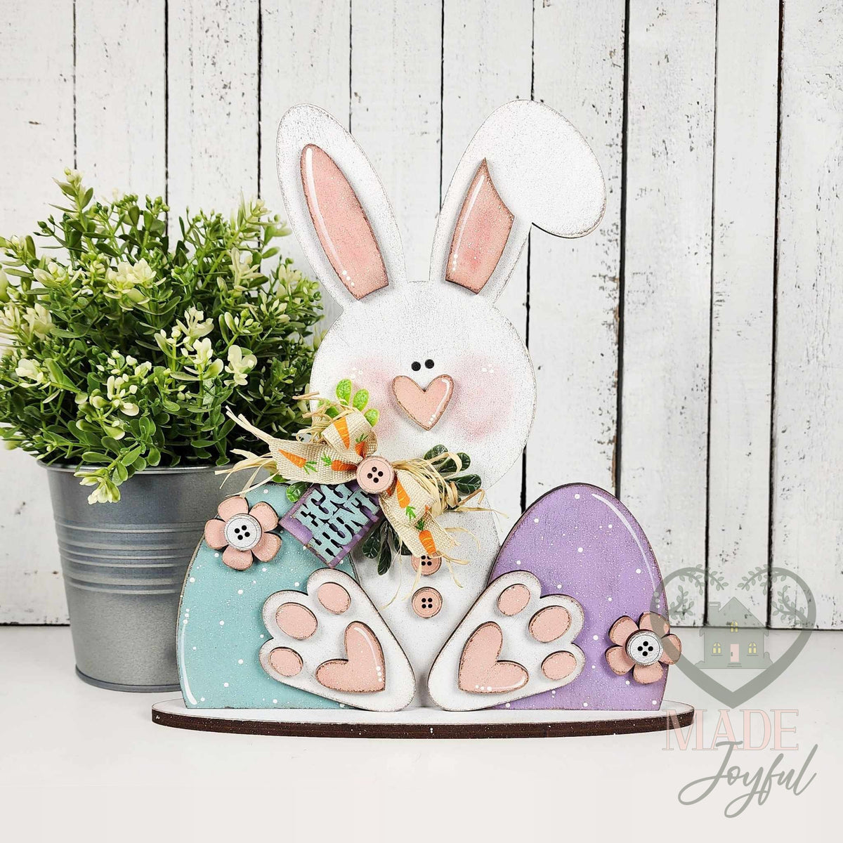 Prim Easter bunny shelf sitter with pastel eggs and a Hop tag, hand-painted in Brentwood, TN.