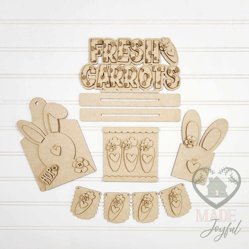 Unfinished laser-cut wood Prim Bunnies & Carrots Tiered Tray Decor Set DIY kit, ready to paint at a DIY party in Williamson County, TN.