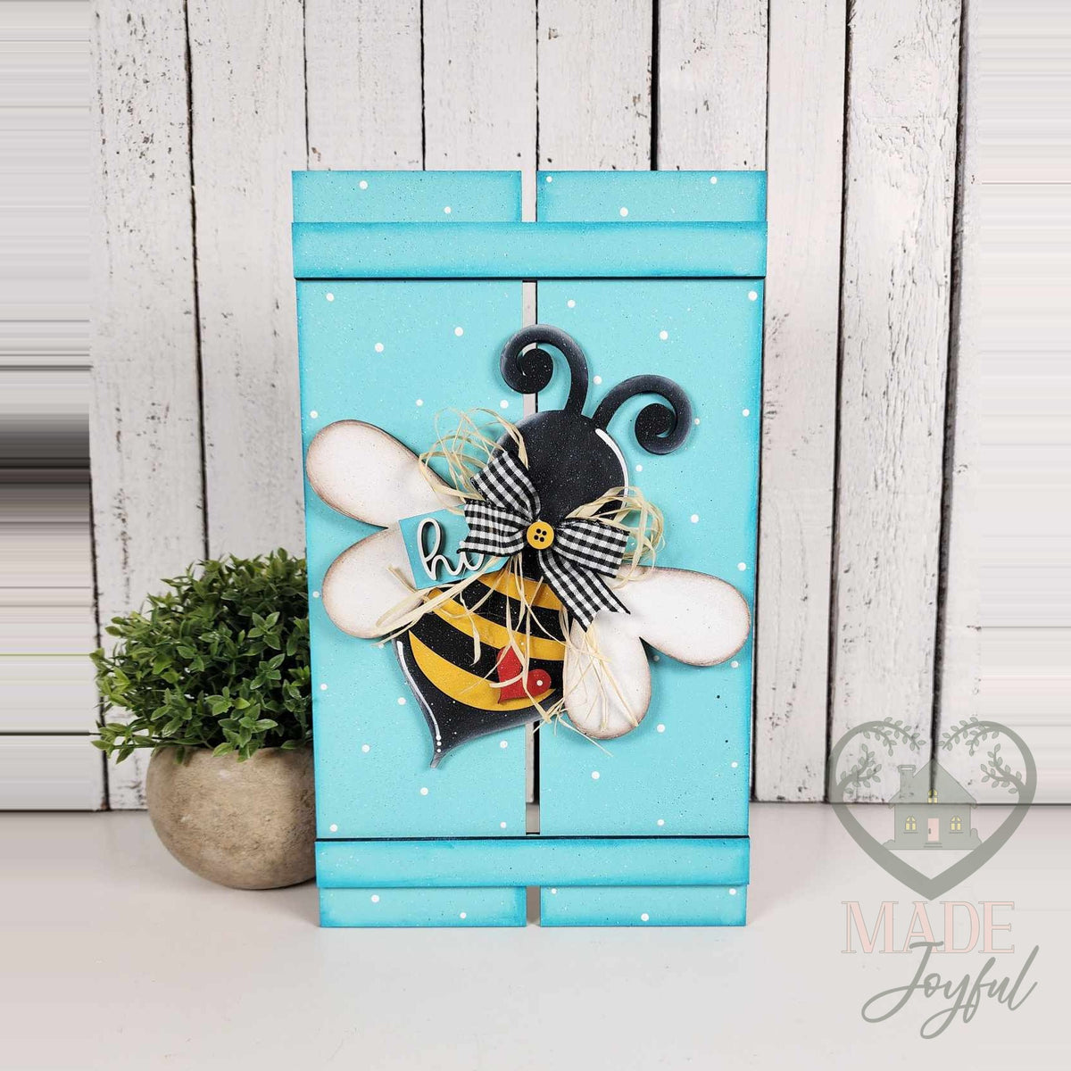 Honey bee pallet leaner painted aqua with a 3D bumblebee, hand-painted in Brentwood, TN.
