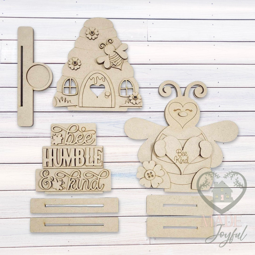 Unfinished laser-cut wood Honey Bee Shelf Sitter Set DIY kit (all three pieces), ready to paint at a DIY party in Williamson County, TN.