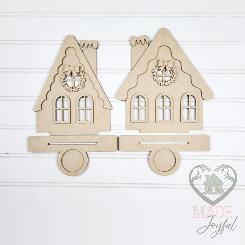 Unfinished laser-cut wood Gingerbread House Votive Holders DIY kit, ready to paint at a DIY party in Williamson County, TN.