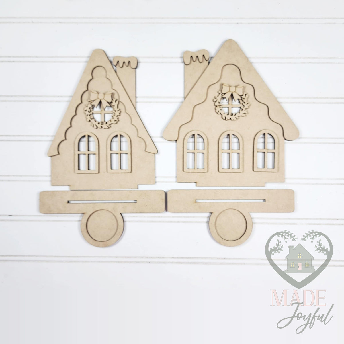 Unfinished laser-cut wood Gingerbread House Votive Holders DIY kit, ready to paint at a DIY party in Williamson County, TN.