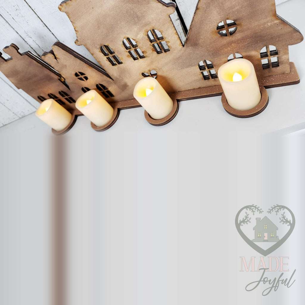 Back of the gingerbread village with four LED tealights, hand-painted in Brentwood, TN.