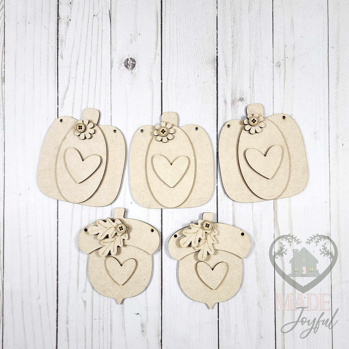 Unfinished laser-cut wood Fall Harvest Pumpkin & Acorn Banner DIY kit, ready to paint at a DIY party in Williamson County, TN.