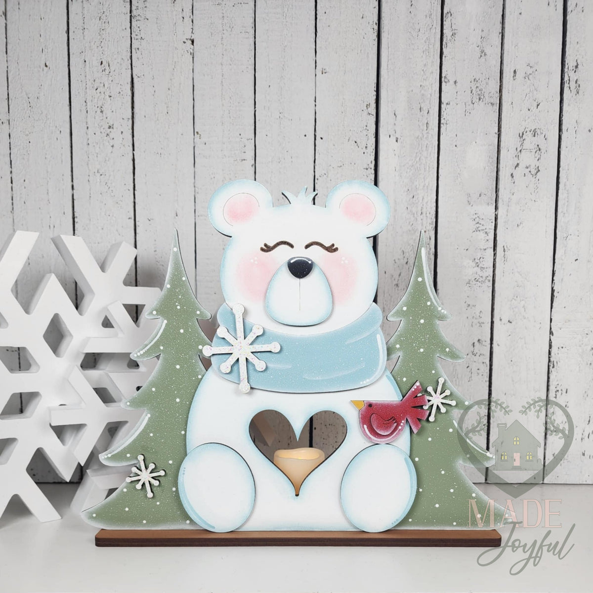 Polar bear votive holder between green trees with heart cut-out, hand-painted in Brentwood, TN.