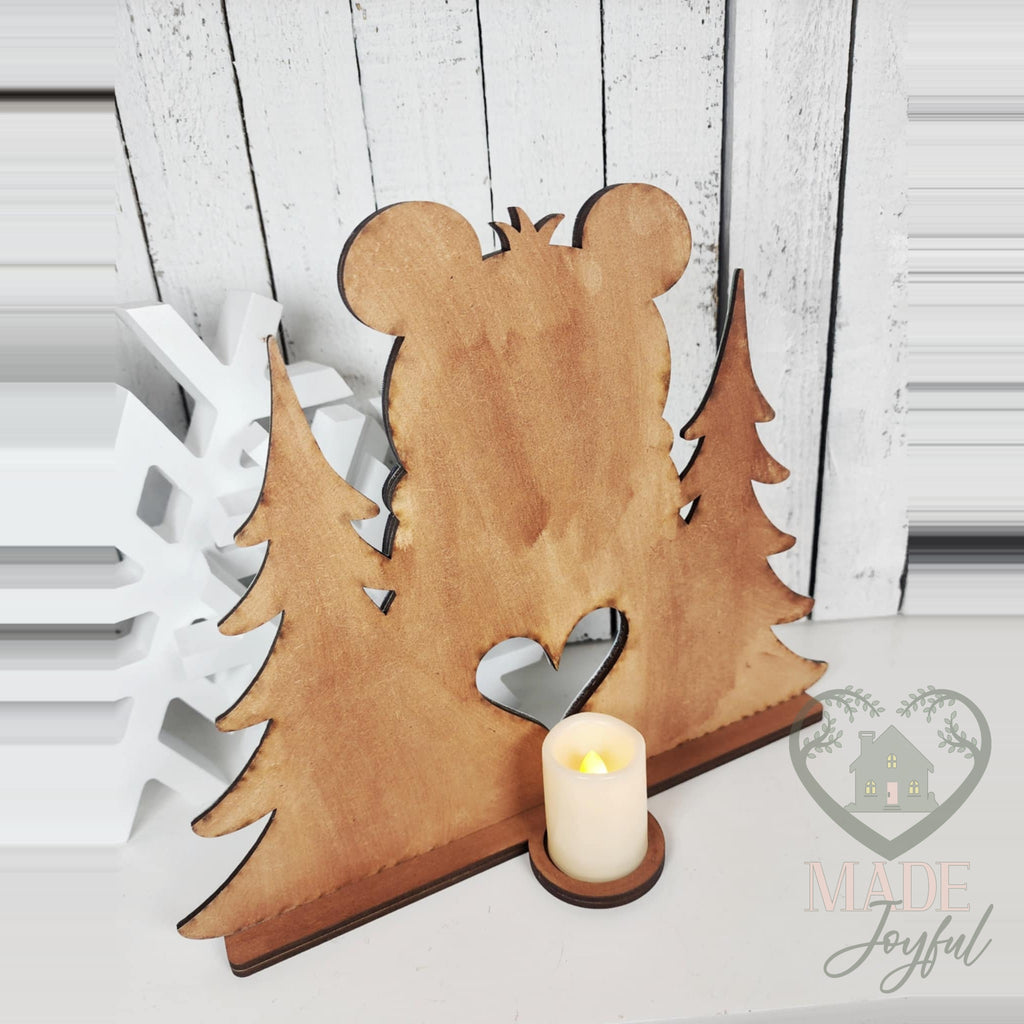 Back of the polar bear votive with a glowing LED tealight, hand-painted in Brentwood, TN.