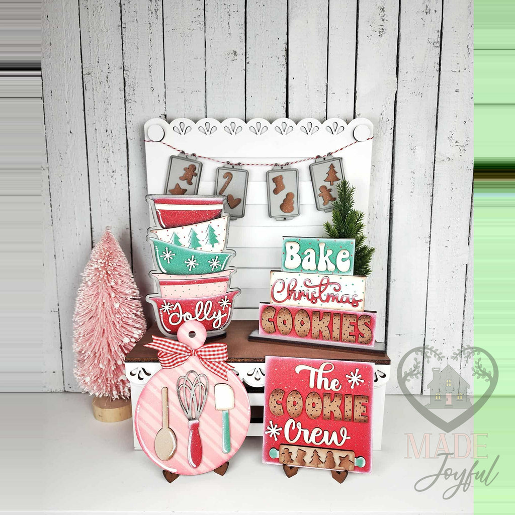 Christmas baking tiered tray set with mixing bowls, Bake Christmas Cookies sign, and The Cookie Crew sign, hand-painted in Brentwood, TN.