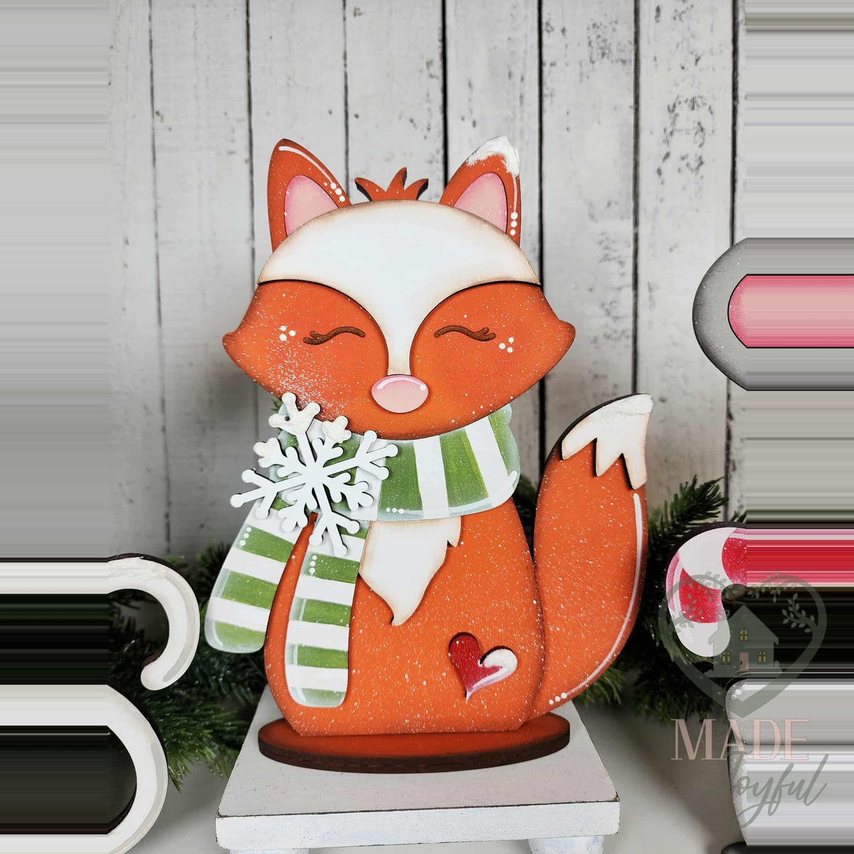 Fox shelf sitter with striped scarf and snowflake, hand-painted in Brentwood, TN.
