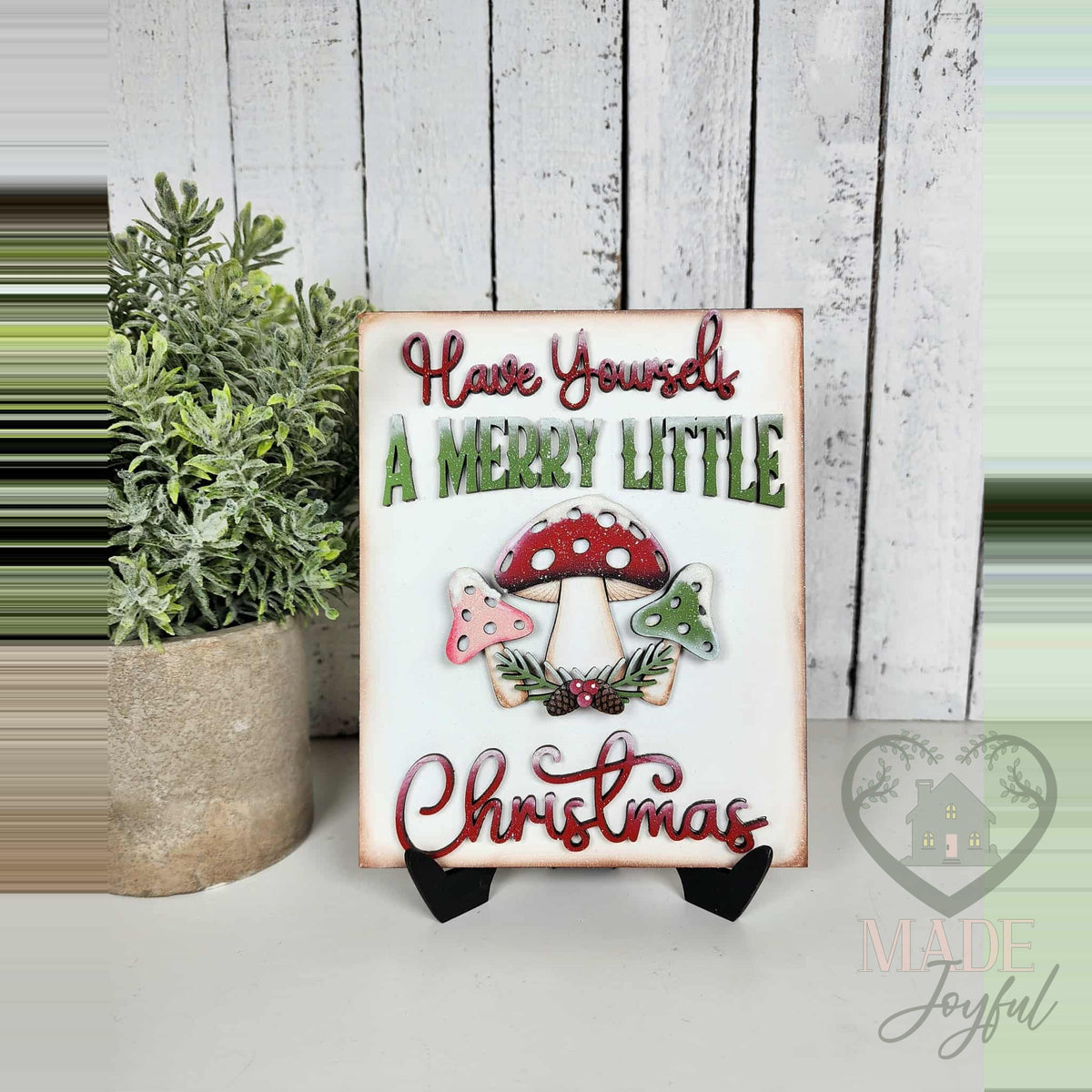 Merry Little Christmas mushroom sign on an easel, hand-painted in Brentwood, TN.