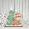 Christmoose standing moose shelf sitter with Santa hat and plaid trees, hand-painted in Brentwood, TN.