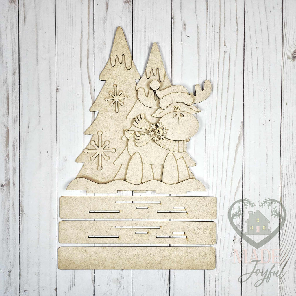 Unfinished laser-cut wood Christmoose Standing Moose Shelf Sitter DIY kit, ready to paint at a DIY party in Williamson County, TN.