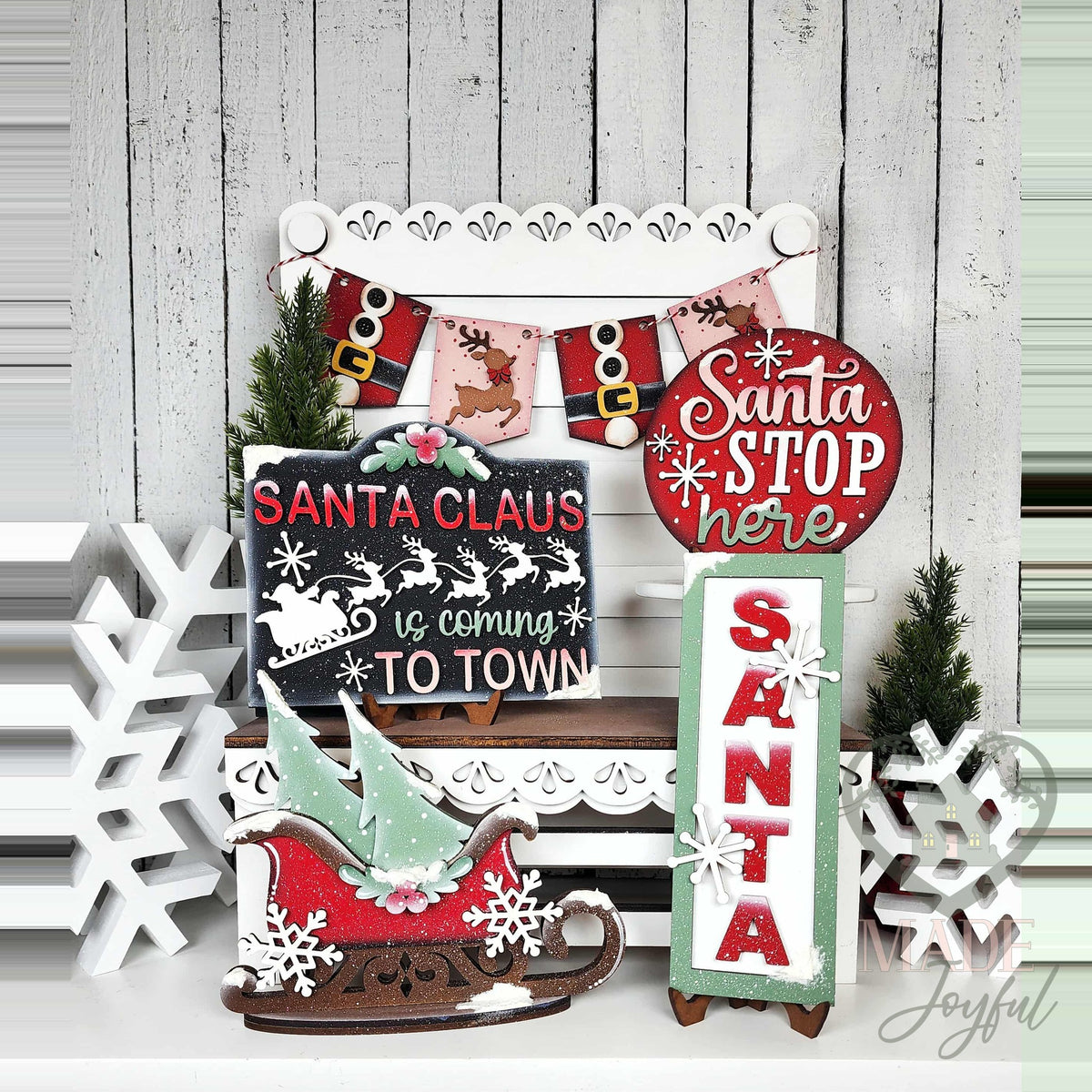 North Pole tiered tray set with Santa Claus Is Coming to Town sign, Santa Stop Here round, and sleigh, hand-painted in Brentwood, TN.
