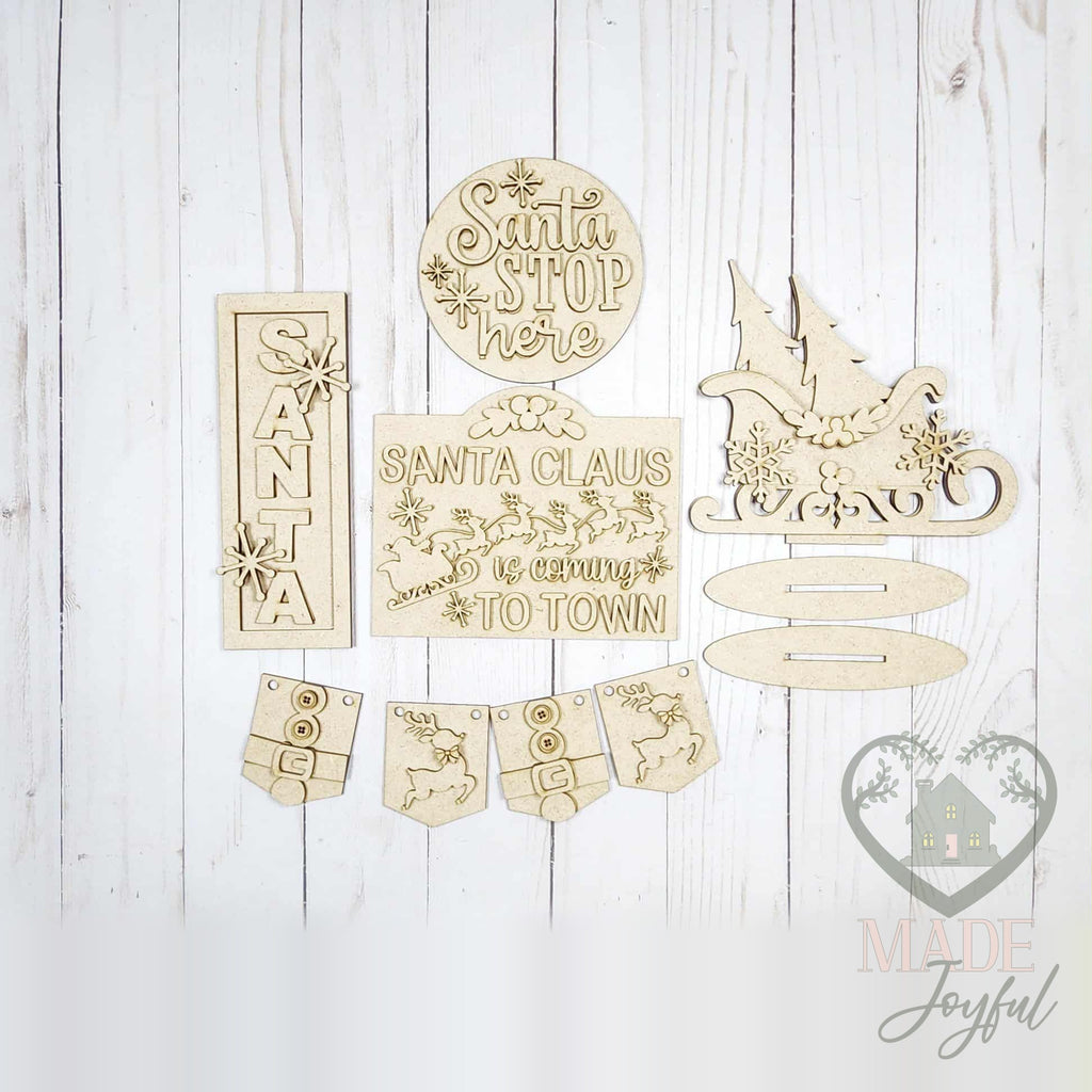 Unfinished laser-cut wood North Pole Tiered Tray Decor Set DIY kit, ready to paint at a DIY party in Williamson County, TN.