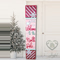 Welcome to the North Pole porch leaner with candy stripes on a front porch, hand-painted in Brentwood, TN.