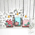 Trio of retro Christmas candle shelf sitters with stripes, poinsettia, and holly, hand-painted in Brentwood, TN.