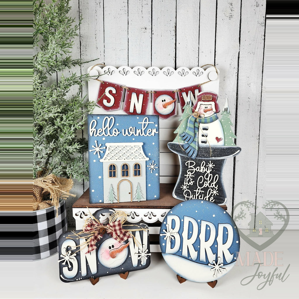 Hello Winter snowman tiered tray set with house sign, snowman, BRRR round, and SNOW banner, hand-painted in Brentwood, TN.