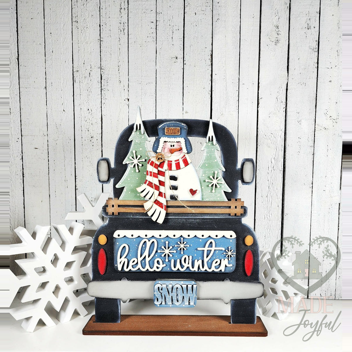 Hello Winter snowman insert in a black truck, hand-painted in Brentwood, TN.