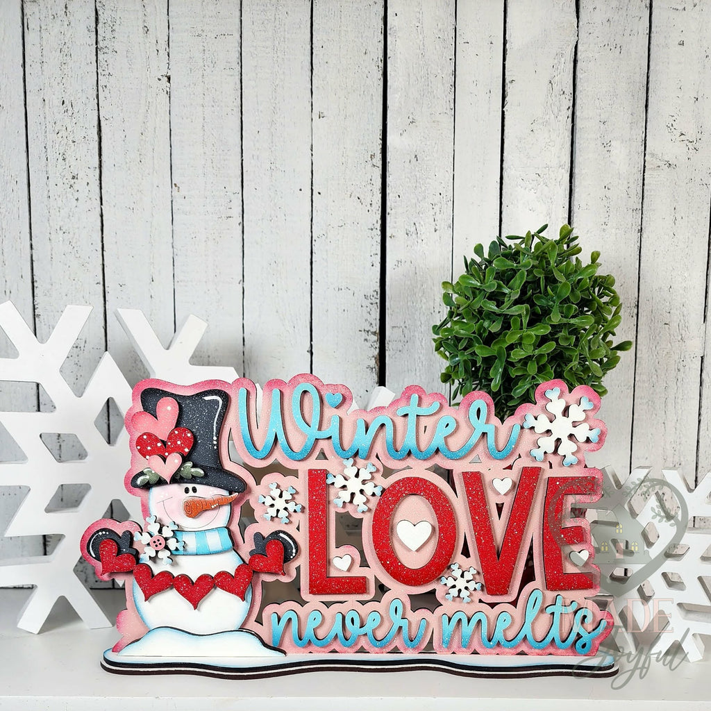 Winter Love Never Melts word art with snowman, hand-painted in Brentwood, TN.
