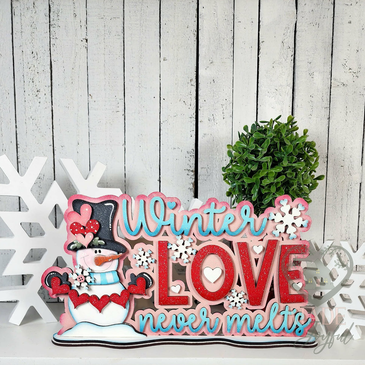 Winter Love Never Melts word art with snowman, hand-painted in Brentwood, TN.