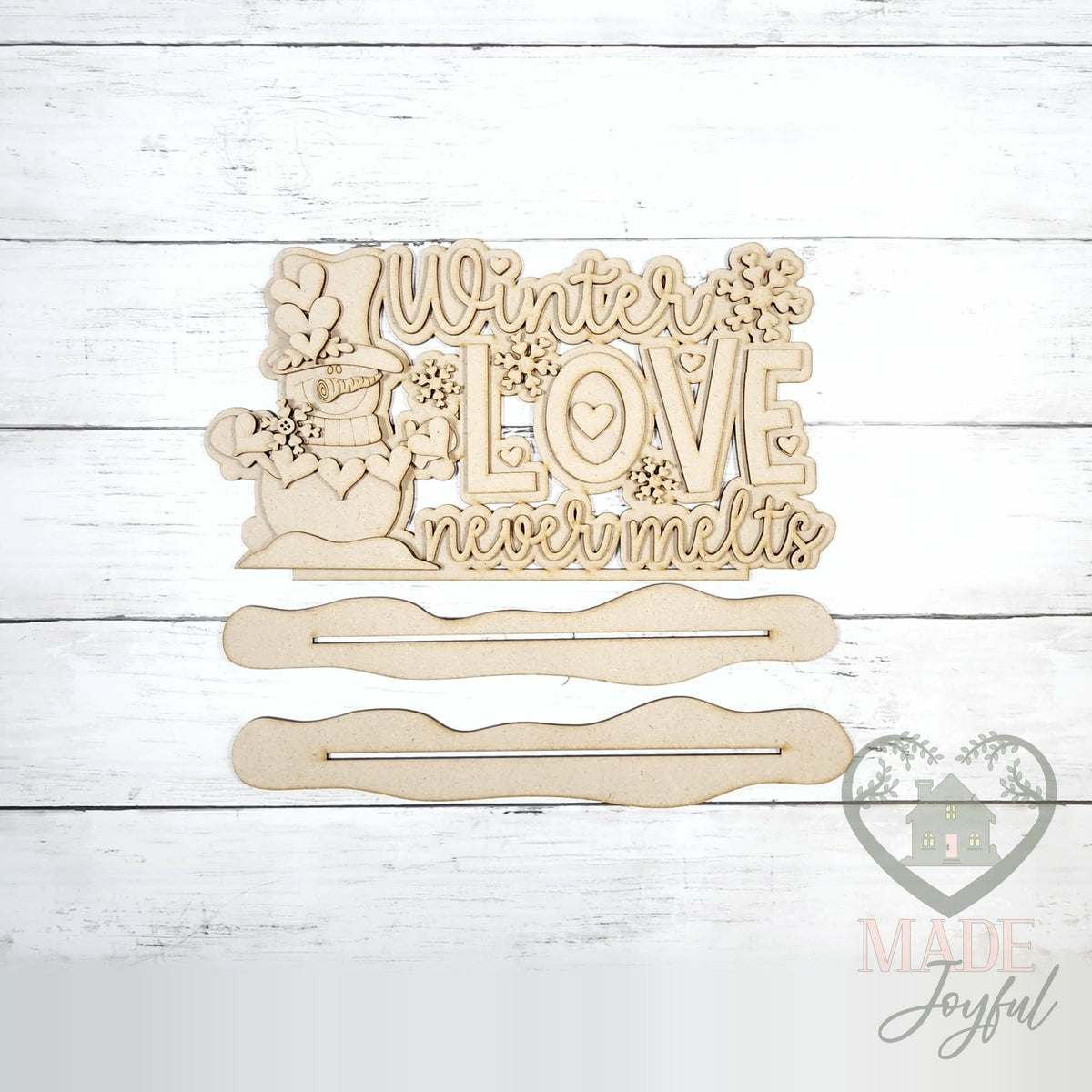 Unfinished laser-cut wood Winter Love Never Melts Word Art DIY kit, ready to paint at a DIY party in Williamson County, TN.