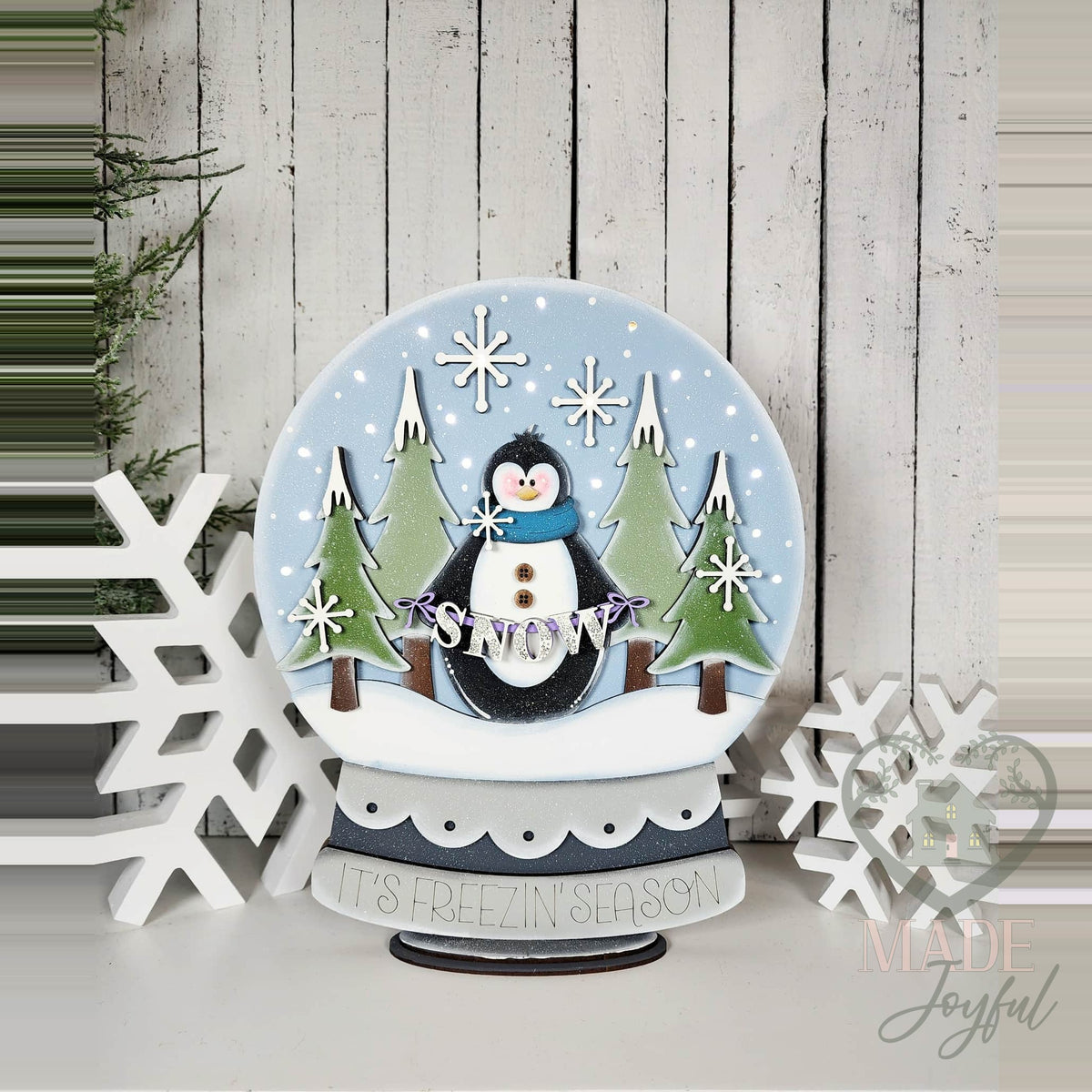 Penguin snow globe shelf sitter with snowy pines, hand-painted in Brentwood, TN.