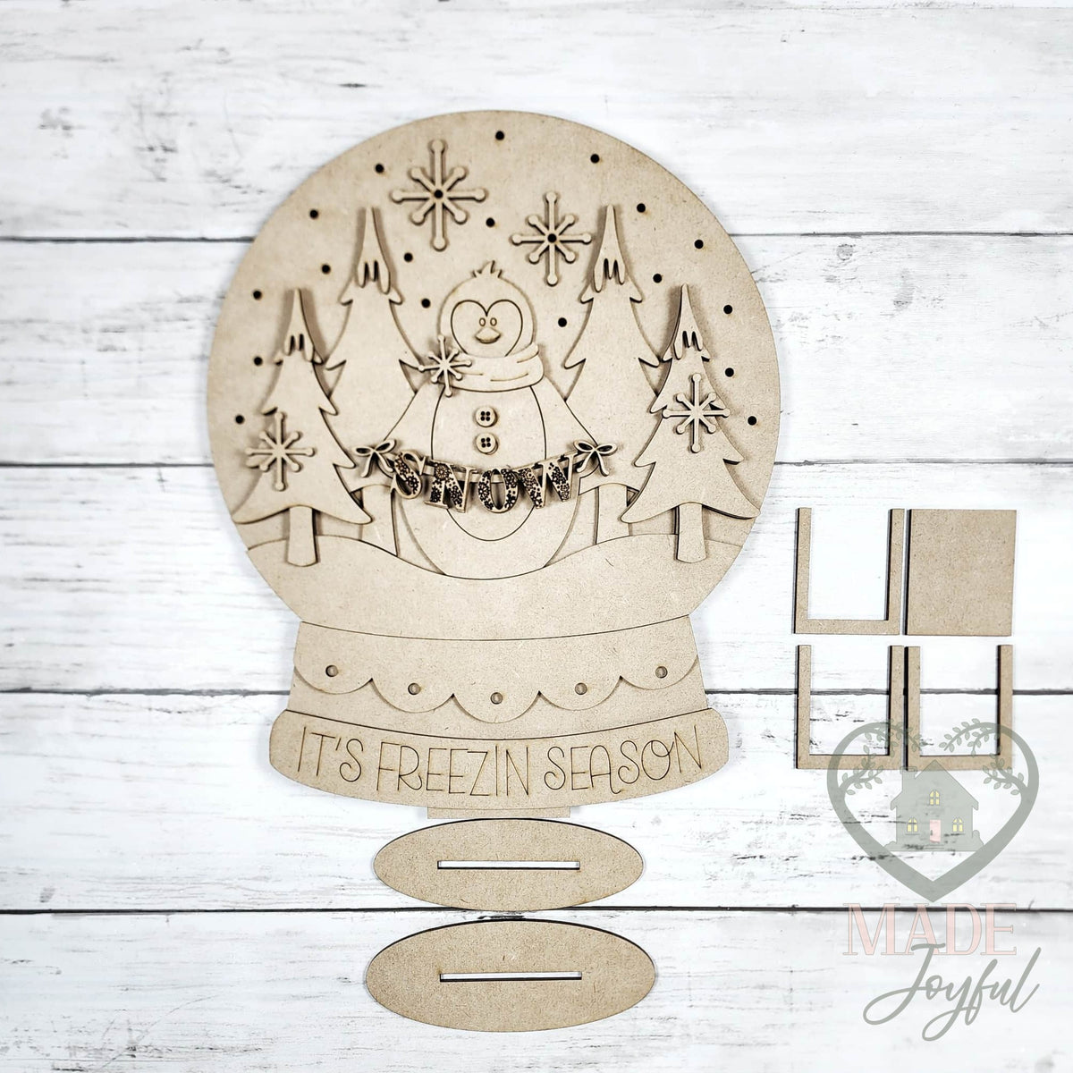 Unfinished laser-cut wood Penguin Snow Globe Shelf Sitter DIY kit, ready to paint at a DIY party in Williamson County, TN.