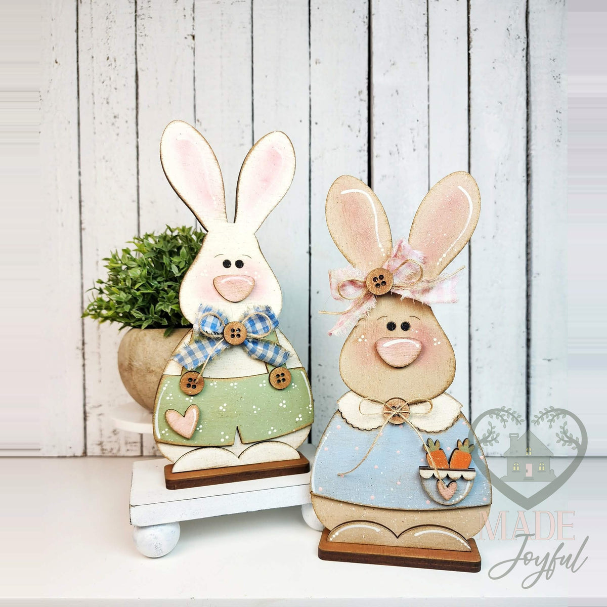 Bunny couple shelf sitters, boy in green overalls and girl in blue dress, hand-painted in Brentwood, TN.