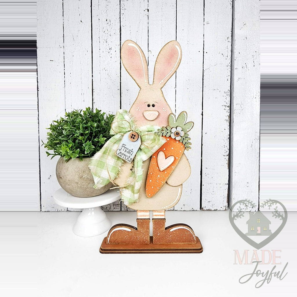 Standing bunny shelf sitter holding a carrot with gingham bow, hand-painted in Brentwood, TN.