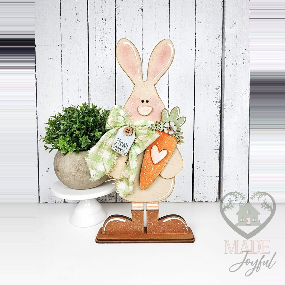 Standing bunny shelf sitter holding a carrot with gingham bow, hand-painted in Brentwood, TN.