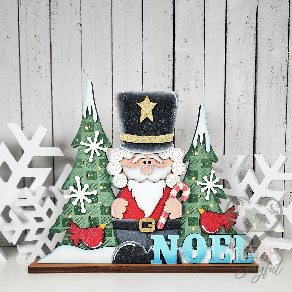 Noel nutcracker shelf sitter with plaid trees and cardinal, hand-painted in Brentwood, TN.