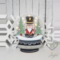 Nutcracker snow globe shelf sitter glowing with fairy lights, hand-painted in Brentwood, TN.
