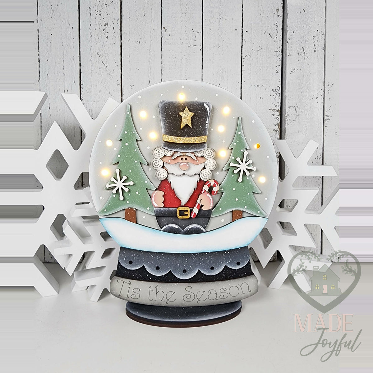 Nutcracker snow globe shelf sitter glowing with fairy lights, hand-painted in Brentwood, TN.