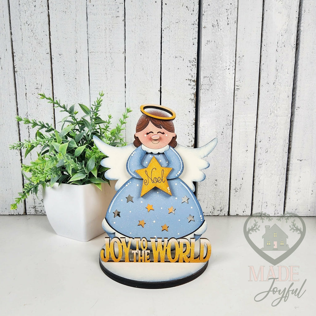 Angel votive on a round base, hand-painted in Brentwood, TN.