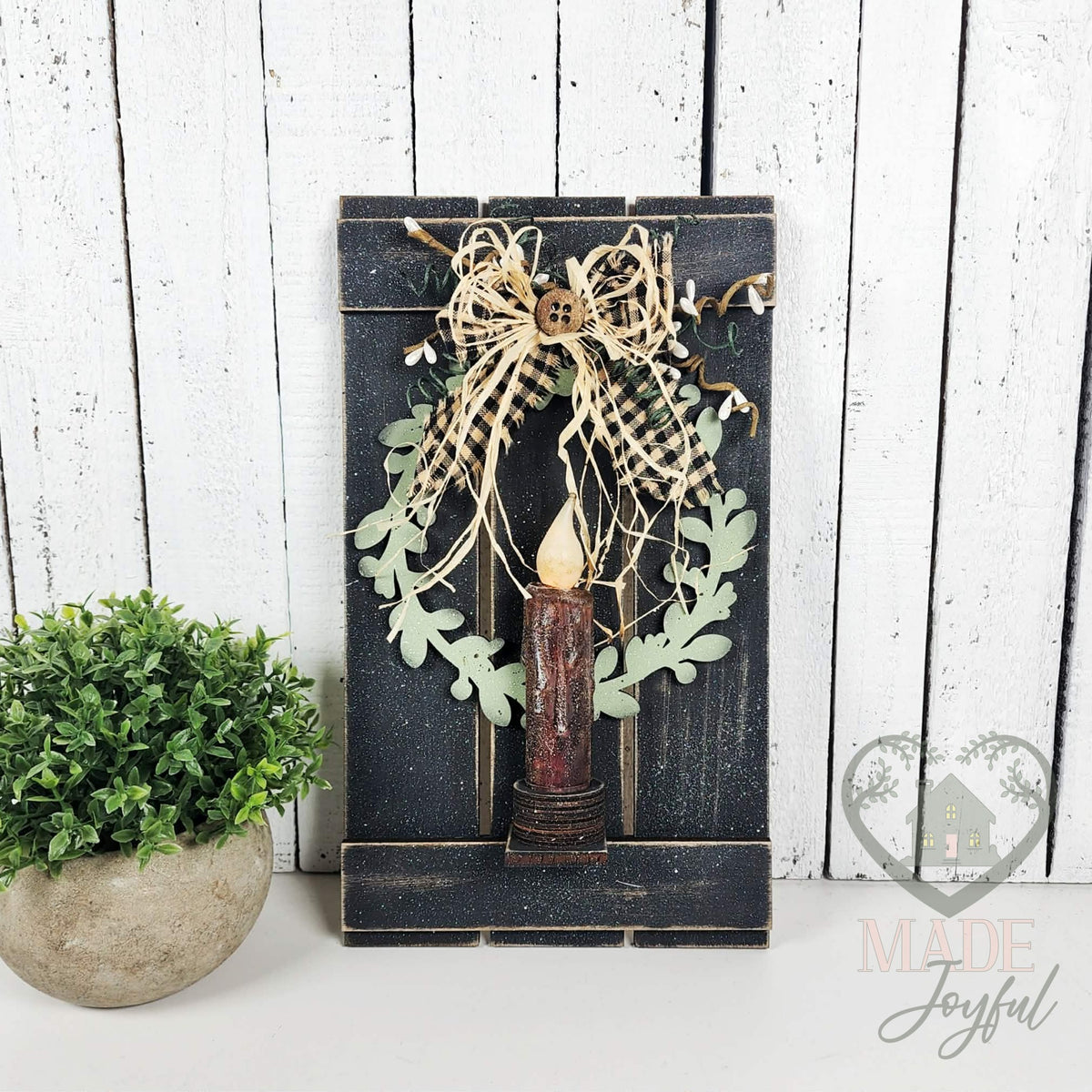 Black pallet candle sconce with wreath, LED candle, and gingham bow, hand-painted in Brentwood, TN.