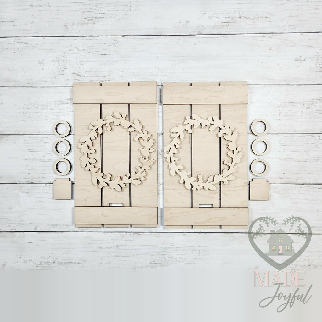 Unfinished laser-cut wood Folk Art Pallet Candle Sconce DIY kit, ready to paint at a DIY party in Williamson County, TN.
