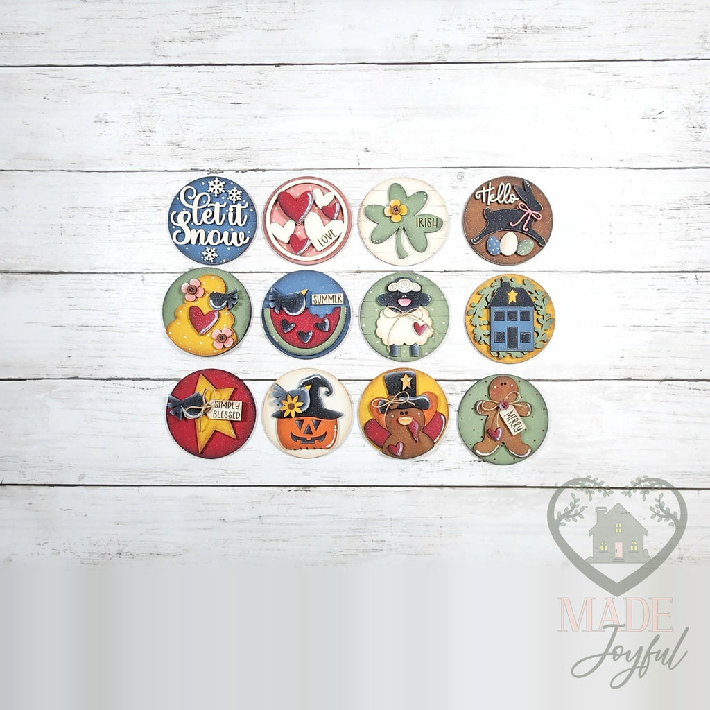 Twelve heirloom folk art 3 inch rounds for every season, hand-painted in Brentwood, TN.