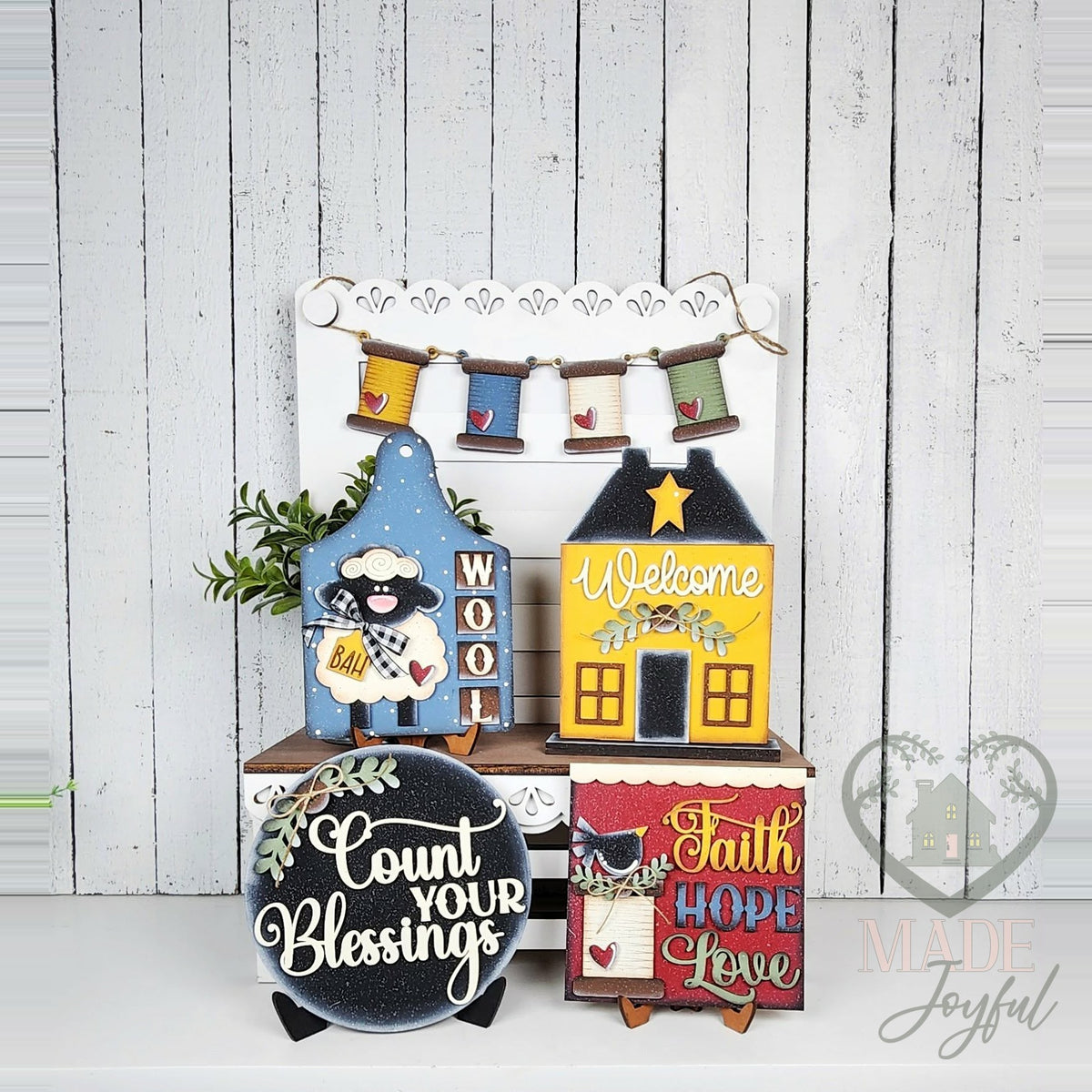 Heirloom folk art tiered tray set with sheep board, saltbox house, and Count Your Blessings round, hand-painted in Brentwood, TN.