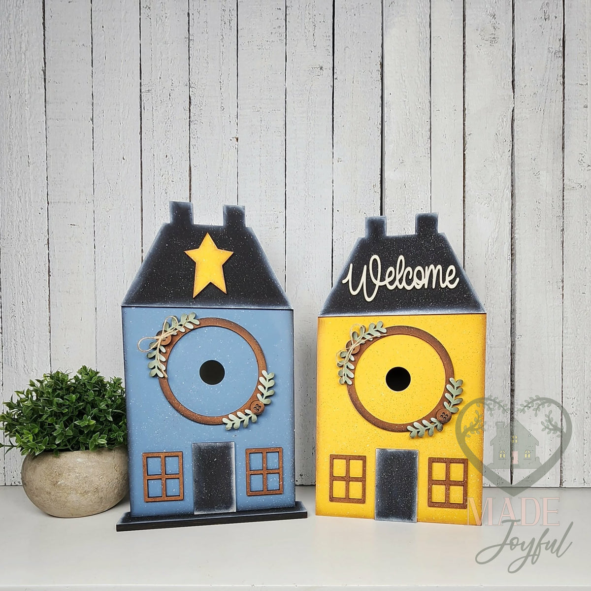Saltbox house displays in blue and yellow, hand-painted in Brentwood, TN.