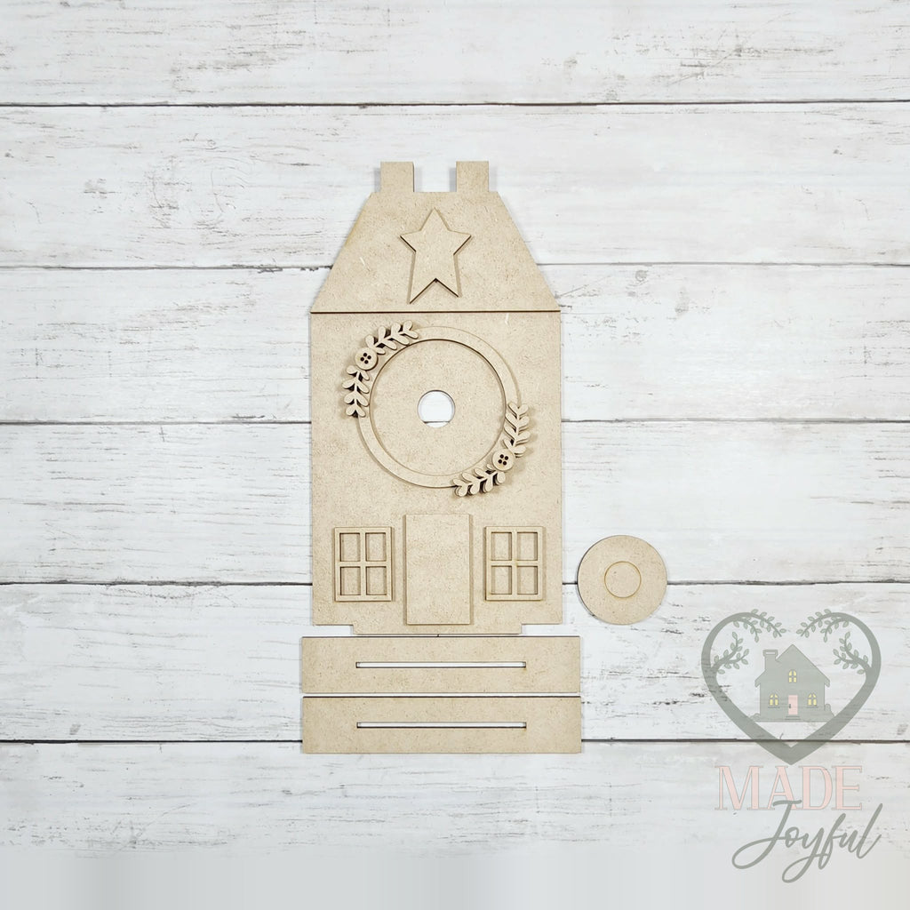 Unfinished laser-cut wood Saltbox House Interchangeable Display DIY kit (tabbed pieces), ready to paint at a DIY party in Williamson County, TN.